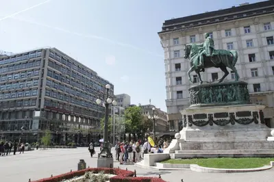 a statue of a horse in the middle of a city at Belgrade Republic Square Apartment in Belgrade