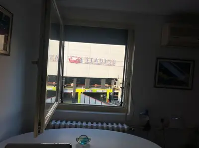 a window with a view of a shopping center at istanbul apartment 4 in Belgrade