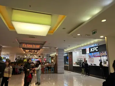 a mall with people walking around in a shopping mall at istanbul apartment 4 in Belgrade