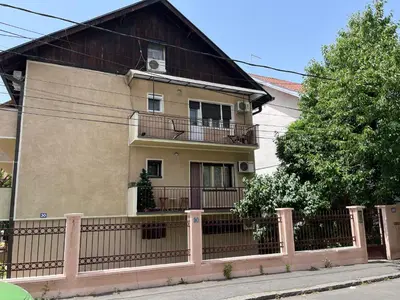 a house with a fence in front of it at istanbul apartment 4 in Belgrade