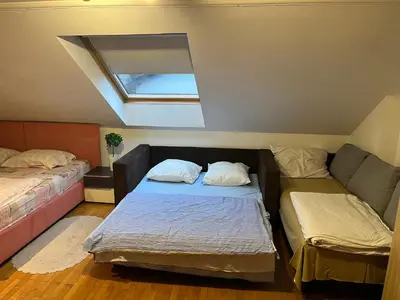 a room with two beds and a couch at istanbul apartment 4 in Belgrade