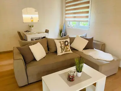 a living room with a couch and a table at Vanja in Čukarica