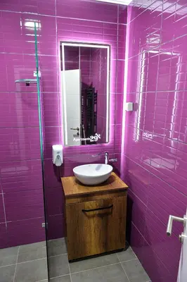 a purple bathroom with a sink and a mirror at Apartments 29 in Inđija