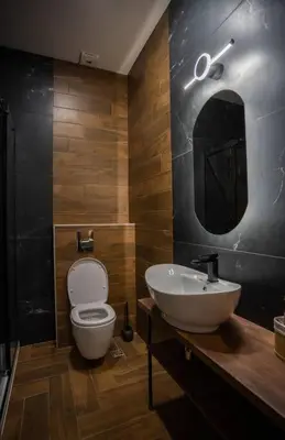 a bathroom with a sink and a toilet and a mirror at Suite Music in Batajnica