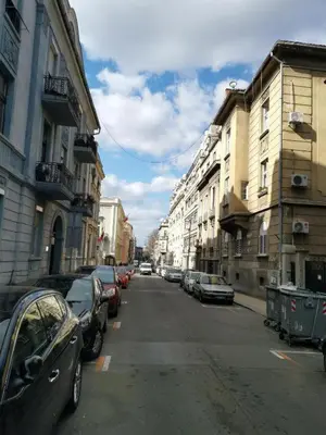 a city street with cars parked on the side of the road at APARTMAN KRUNA in Belgrade