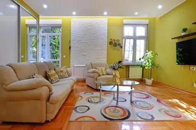 a living room with a couch and a table at APARTMAN KRUNA in Belgrade