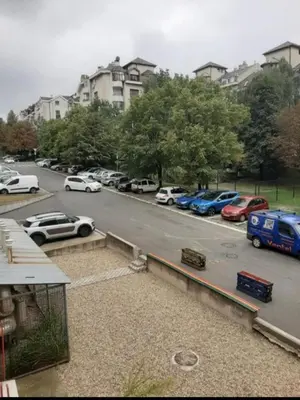 a parking lot with a bunch of cars parked at TPC 9 in Žarkovo