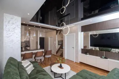 a living room with a couch and a table at Hemingway LUX in Arandjelovac