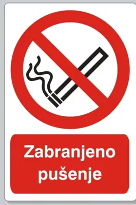 a sign with a no smoking sign at Coral Studio in Batajnica