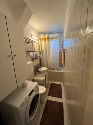 a small bathroom with a toilet and a sink at Sara in Zvezdara