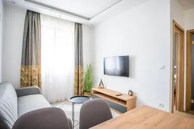 a living room with a couch and a table at The boy next door apartment in Batajnica