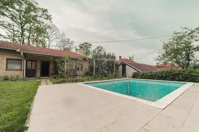 a swimming pool in the yard of a house at Cvrkut Ptica - Mladenovac in Mladenovac