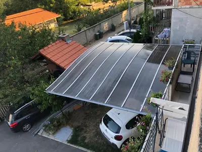 an overhead view of a car parked in a parking lot at Apartmani MilaMi #3 in Kalugjerica