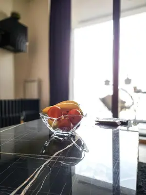 a bowl of fruit sitting on a table at Belgrade Waterfront - Beograd na vodi Lux Apartman in Belgrade