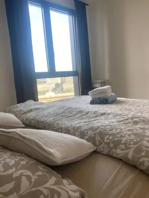 a bedroom with two beds and a window at Belgrade Waterfront - Beograd na vodi Lux Apartman in Belgrade