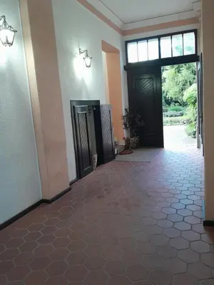 an empty room with a door and a hallway with a floor at VILA SREM in Ruma