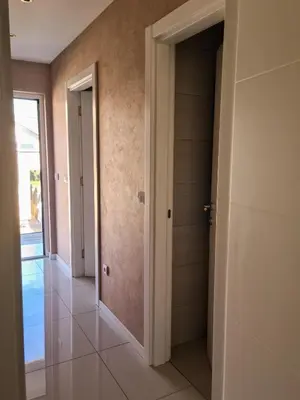 a hallway of a house with a closet and a door at Apartman Cookie Kolačić blizu aerodroma Nikola Tesla in Dobanovci