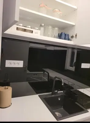 a kitchen with a sink and a counter top at Apartman Cookie Kolačić blizu aerodroma Nikola Tesla in Dobanovci