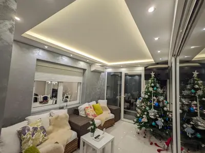 a living room with a christmas tree in it at Apartman Cookie Kolačić blizu aerodroma Nikola Tesla in Dobanovci