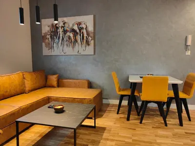 a living room with a couch and a table at City Center Belgrade Dorćol Square in Belgrade