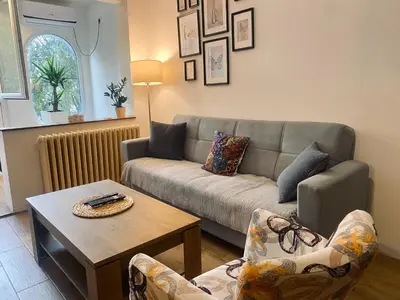 a living room with a couch and a table at Apartman ANN II in Pančevo