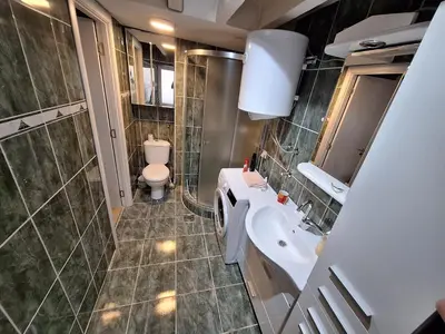 a bathroom with a sink and a toilet in it at River Walk 2 in Sajmište