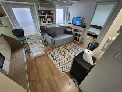 an overhead view of a living room with a couch and a television at River Walk 2 in Sajmište