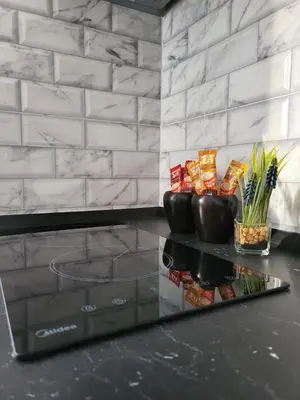 a counter with a glass table with snacks on it at SLEEP & GO in Surčin