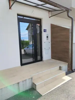 a building with a door and stairs in front at Noa in Ledine