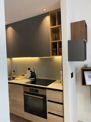 a kitchen with a sink and a stove top oven at Symphony707 - Belgrade waterfront in Belgrade