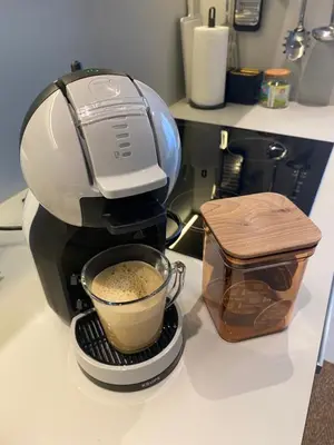 a coffee maker on a counter with a cup of coffee at Symphony707 - Belgrade waterfront in Belgrade