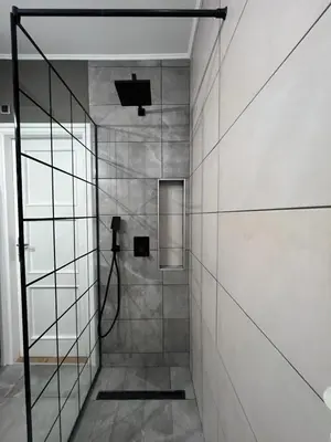 a bathroom with a shower with a glass wall at Admiral Downtown 2 in Belgrade