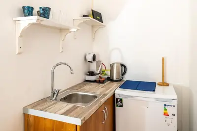 a small kitchen with a sink and a dishwasher at Marshall Residence in Belgrade