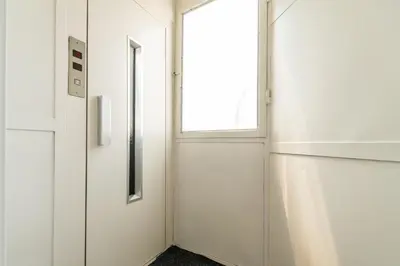 a hallway with a door and a window at Marshall Residence in Belgrade