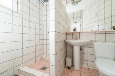 a bathroom with a toilet and a sink at Marshall Residence in Belgrade