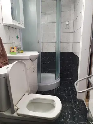 a bathroom with a toilet and a glass shower at Small cute doublebed room A4 in Pančevo in Pančevo