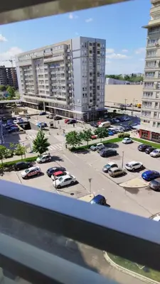 a view of a parking lot with cars in a parking lot at Manhattan studio Seboj Belvil in Novi Beograd