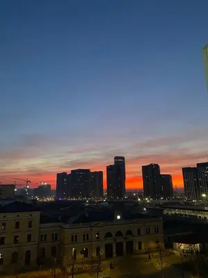 a view of a city skyline at sunset at Apartman Central Place in Belgrade