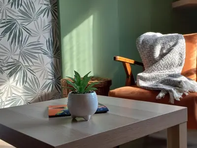 a coffee table with a plant on top of it at Apartman Central Place in Belgrade