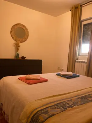 a bedroom with a bed with two towels on it at AmazingMemories3 in Belgrade