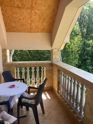 a balcony with a table and chairs and a window at AmazingMemories3 in Belgrade