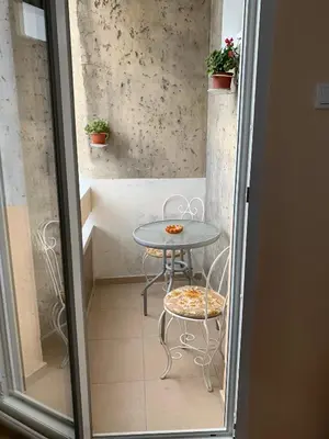 a small table and chairs in a small room at Apartment Tašmajdan in Belgrade