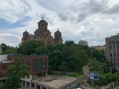 a large building with two towers on top of a city at Apartment Tašmajdan in Belgrade