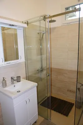 a bathroom with a shower and a sink at Apartment Tašmajdan in Belgrade