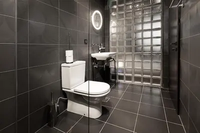 a bathroom with a toilet and a sink at Avangarda Suites in Belgrade