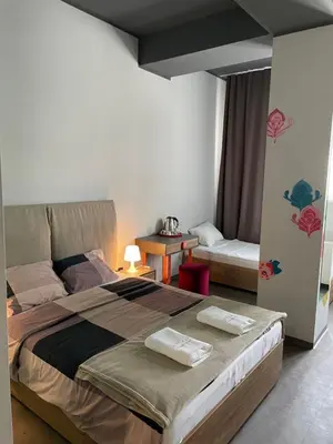 a bedroom with a large bed in a room at Avangarda Suites in Belgrade