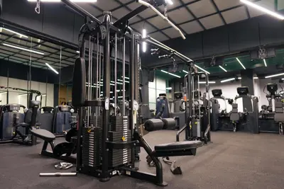 a gym with a bunch of equipment in it at Avangarda Suites in Belgrade