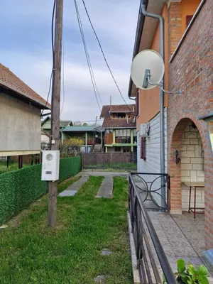 an outside view of a house with a fence at Vila Soleil in Smederevo
