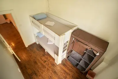 an overhead view of a white desk in a room at All in Hostel in Belgrade