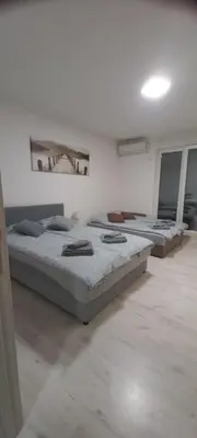 a room with three beds in a room at Apartment BeoSun in Belgrade